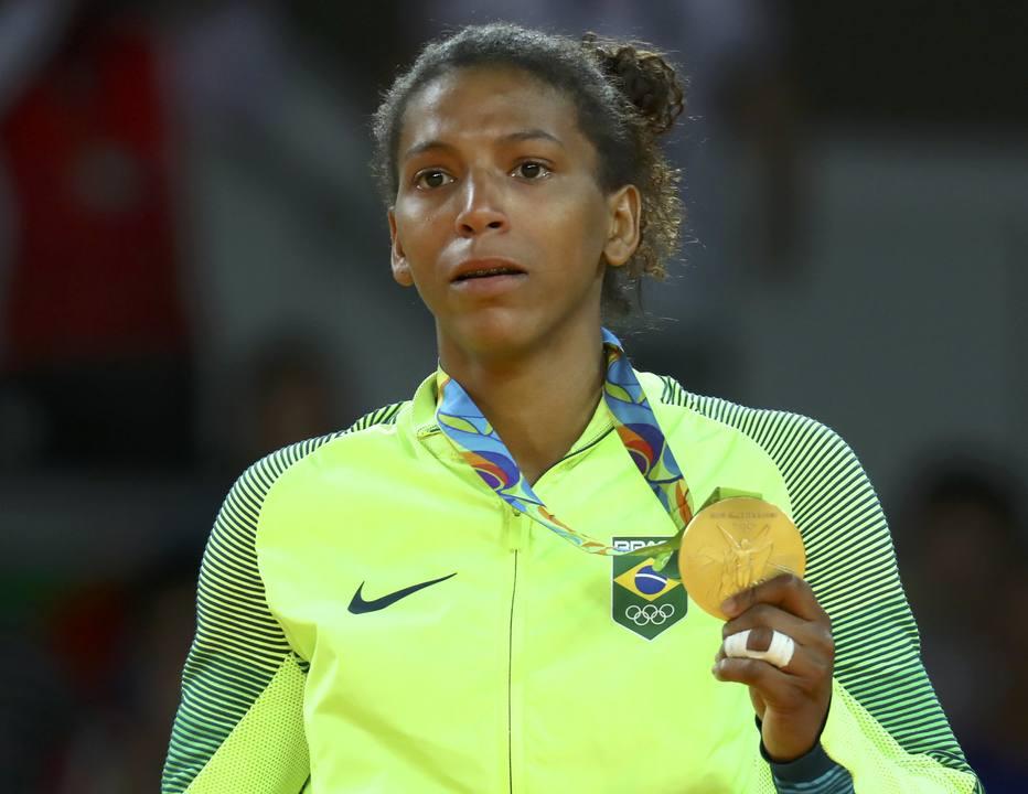 2016 Rio Olympics - Judo - Victory Ceremony - Women -57 kg Victory Ceremony - Carioca Arena 2 - Rio de Janeiro, Brazil - 08/08/2016. Rafaela Silva (BRA) of Brazil poses with her medal. REUTERS/Kai Pfaffenbach FOR EDITORIAL USE ONLY. NOT FOR SALE FOR MARKETING OR ADVERTISING CAMPAIGNS.