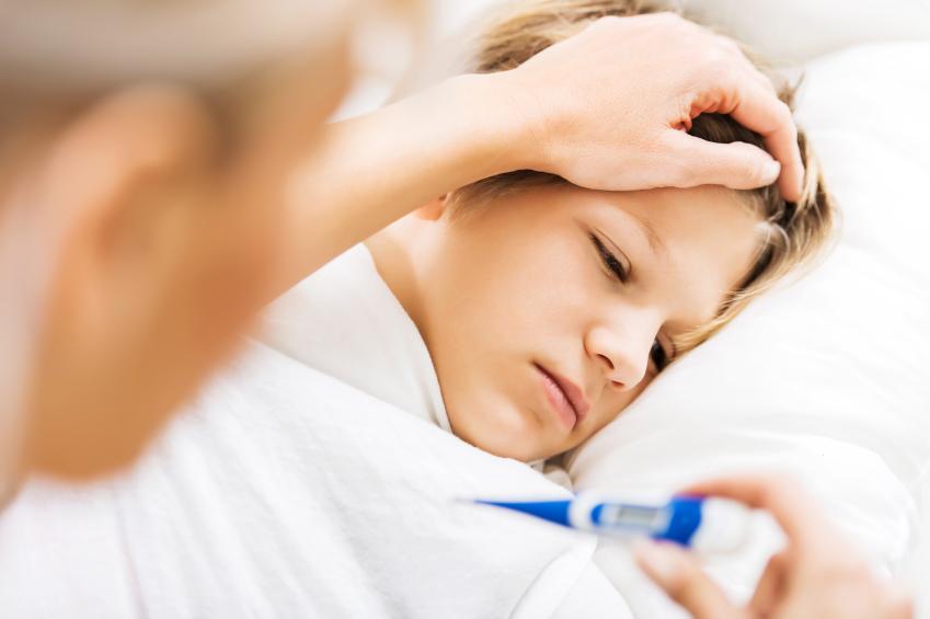 Close up of mother taking her son's temperature. [url=http://www.istockphoto.com/search/lightbox/9786778][img]http://dl.dropbox.com/u/40117171/family.jpg[/img][/url]